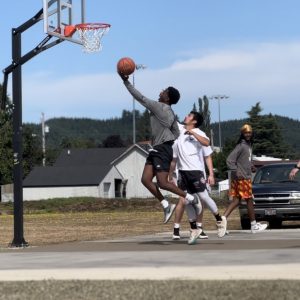 A player stretches for a layup.